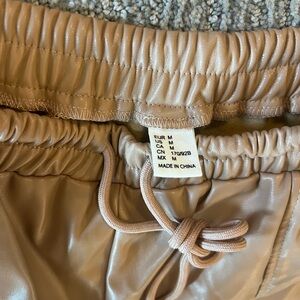 Brand New without tags Faux leather tan pants